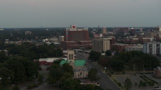 DX0002_186_044 - 5.7K aerial stock footage of circling a hospital at twilight in Memphis, Tennessee