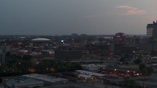 DX0002_187_001 - 5.7K aerial stock footage of city buildings and FedEx Forum at twilight, Downtown Memphis, Tennessee