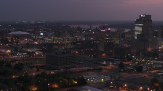 DX0002_187_015 - 5.7K aerial stock footage of AutoZone Park baseball stadium at twilight, Downtown Memphis, Tennessee