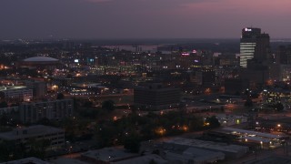 DX0002_187_016 - 5.7K aerial stock footage of an orbit of AutoZone Park baseball stadium at twilight, Downtown Memphis, Tennessee