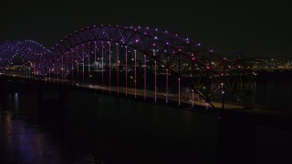 DX0002_187_050 - 5.7K aerial stock footage of lights on the bridge at night, Downtown Memphis, Tennessee