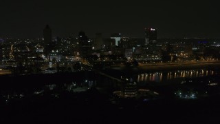 DX0002_187_059 - 5.7K aerial stock footage of circling the city's downtown skyline at night, Downtown Memphis, Tennessee
