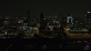DX0002_187_061 - 5.7K aerial stock footage orbit around the city's downtown skyline at night, Downtown Memphis, Tennessee