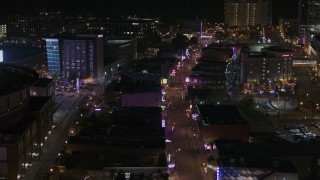 DX0002_188_001 - 5.7K aerial stock footage of flying by Beale Street at nighttime, Downtown Memphis, Tennessee