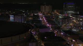 DX0002_188_002 - 5.7K aerial stock footage flyby arena to reveal Beale Street at nighttime, Downtown Memphis, Tennessee