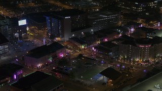 DX0002_188_004 - 5.7K aerial stock footage of orbiting the Beale Street intersection at nighttime, Downtown Memphis, Tennessee