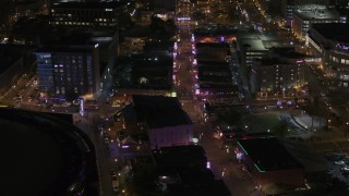 DX0002_188_005 - 5.7K aerial stock footage of a view down Beale Street at nighttime, Downtown Memphis, Tennessee