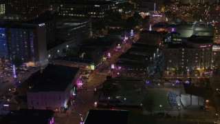 DX0002_188_008 - 5.7K aerial stock footage orbit Beale Street intersection with bright lights and signs at nighttime, Downtown Memphis, Tennessee