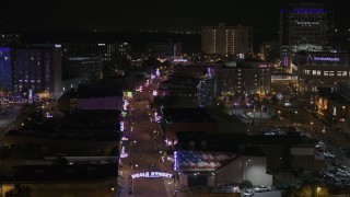 DX0002_188_013 - 5.7K aerial stock footage fly around arena to reveal Beale Street at nighttime, Downtown Memphis, Tennessee