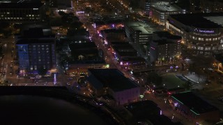 DX0002_188_016 - 5.7K aerial stock footage of busy Beale Street at nighttime, Downtown Memphis, Tennessee