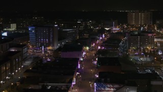 DX0002_188_017 - 5.7K aerial stock footage of orbiting busy Beale Street at nighttime, Downtown Memphis, Tennessee