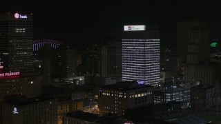 DX0002_188_025 - 5.7K aerial stock footage of slowly approaching First Tennessee Building at nighttime, Downtown Memphis, Tennessee