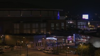 DX0002_188_028 - 5.7K aerial stock footage of an orbit of the Beale Street sign at nighttime, Downtown Memphis, Tennessee