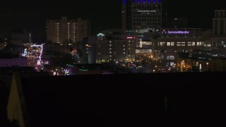 DX0002_188_029 - 5.7K aerial stock footage of an office complex at nighttime, Downtown Memphis, Tennessee