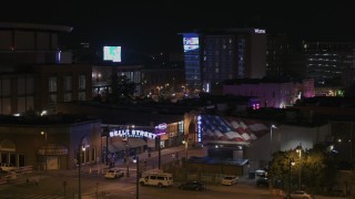 DX0002_188_032 - 5.7K aerial stock footage of a static view of the Beale Street sign at nighttime, Downtown Memphis, Tennessee