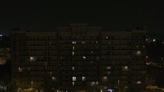 DX0002_188_045 - 5.7K aerial stock footage orbit an office building at nighttime, Memphis, Tennessee