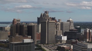 DX0002_189_041 - 5.7K aerial stock footage of the Patrick V. McNamara Federal Building and skyscrapers, Downtown Detroit, Michigan