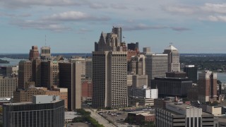 DX0002_189_042 - 5.7K aerial stock footage passing by the Patrick V. McNamara Federal Building and skyscrapers, Downtown Detroit, Michigan