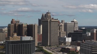 DX0002_189_043 - 5.7K aerial stock footage flyby and away from federal building and skyscrapers, Downtown Detroit, Michigan