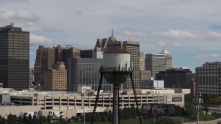 DX0002_189_045 - 5.7K aerial stock footage of circling a water tower in Downtown Detroit, Michigan