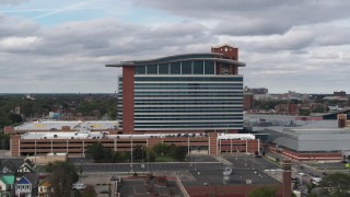 DX0002_190_001 - 5.7K aerial stock footage of ascending past MotorCity Casino Hotel in Detroit, Michigan