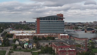 DX0002_190_002 - 5.7K aerial stock footage of orbiting the MotorCity Casino Hotel in Detroit, Michigan