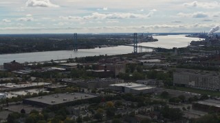 DX0002_190_005 - 5.7K aerial stock footage of the Ambassador Bridge spanning the Detroit River, Detroit, Michigan