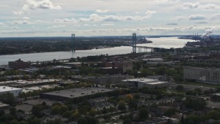DX0002_190_007 - 5.7K aerial stock footage of the Ambassador Bridge across the Detroit River, Detroit, Michigan