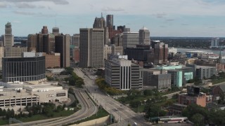DX0002_190_010 - 5.7K aerial stock footage flyby and approach a federal building and skyscrapers, Downtown Detroit, Michigan