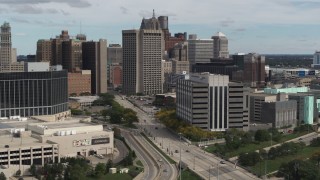 DX0002_190_011 - 5.7K aerial stock footage descend with view of a federal building and police headquarters, Downtown Detroit, Michigan