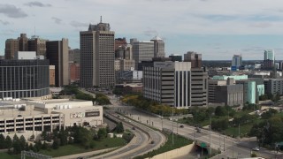 DX0002_190_012 - 5.7K aerial stock footage of orbiting police headquarters, Downtown Detroit, Michigan