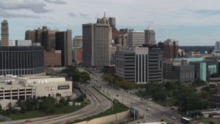 DX0002_190_016 - 5.7K aerial stock footage fly away from downtown police headquarters and descend, Downtown Detroit, Michigan