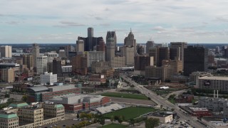 DX0002_190_020 - 5.7K aerial stock footage of passing the towering skyscrapers in the city's skyline, Downtown Detroit, Michigan