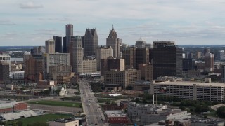 DX0002_190_029 - 5.7K aerial stock footage flying by tall skyscrapers in the city's skyline, Downtown Detroit, Michigan