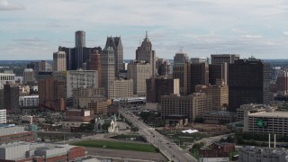 DX0002_190_030 - 5.7K aerial stock footage passing by tall skyscrapers in the city's skyline, Downtown Detroit, Michigan
