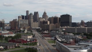 DX0002_190_032 - 5.7K aerial stock footage descend by Grand River Avenue, view of the city's skyline, Downtown Detroit, Michigan