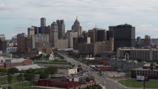 DX0002_190_034 - 5.7K aerial stock footage descend near Grand River Avenue, view of the city's skyline, Downtown Detroit, Michigan