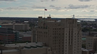 DX0002_190_043 - 5.7K aerial stock footage orbit the top of the Detroit Masonic Temple building, Detroit, Michigan