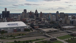 DX0002_191_010 - 5.7K aerial stock footage the skyline behind Ford Field and Comerica Park stadiums, Downtown Detroit, Michigan