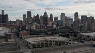 DX0002_191_016 - 5.7K aerial stock footage fly away from Comerica Park baseball stadium and skyline, Downtown Detroit, Michigan
