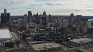 DX0002_191_017 - 5.7K aerial stock footage fly toward Comerica Park baseball stadium and skyline, Downtown Detroit, Michigan
