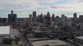 DX0002_191_018 - 5.7K aerial stock footage descend with view of baseball stadium and skyline, Downtown Detroit, Michigan