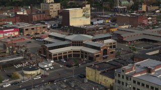 DX0002_191_048 - 5.7K aerial stock footage circling a farmers market at sunset in Detroit, Michigan