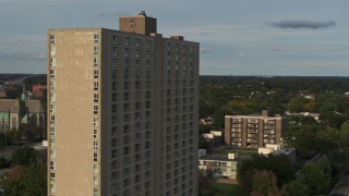 DX0002_192_001 - 5.7K aerial stock footage of the City Place Detroit apartment building at sunset, Detroit, Michigan