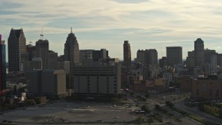 DX0002_192_005 - 5.7K aerial stock footage flyby the city skyline at sunset, descend with view of courthouse, Downtown Detroit, Michigan