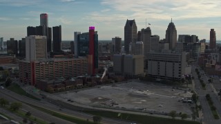 DX0002_192_010 - 5.7K aerial stock footage of a hotel and courthouse at sunset, Downtown Detroit, Michigan