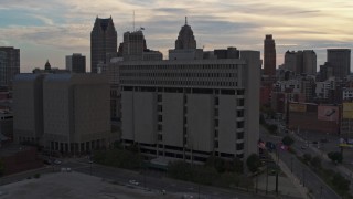 DX0002_192_025 - 5.7K aerial stock footage of orbiting Frank Murphy Hall of Justice courthouse at sunset, Downtown Detroit, Michigan
