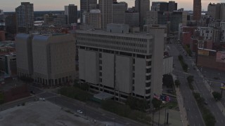 DX0002_192_029 - 5.7K stock footage aerial of the Frank Murphy Hall of Justice while descending at sunset, Downtown Detroit, Michigan