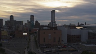 DX0002_192_030 - 5.7K stock footage aerial of a reverse view of the Detroit Thermal plant at sunset, Downtown Detroit, Michigan