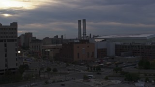 DX0002_192_031 - 5.7K stock footage aerial of approaching the Detroit Thermal plant at sunset, Downtown Detroit, Michigan
